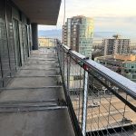 Aluminum track layout on concrete balcony before tiling in Burnaby BC