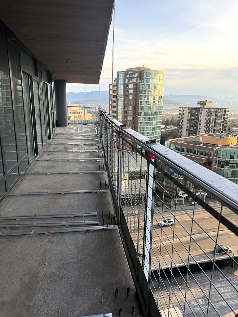 Aluminum track layout on concrete balcony before tiling in Burnaby BC