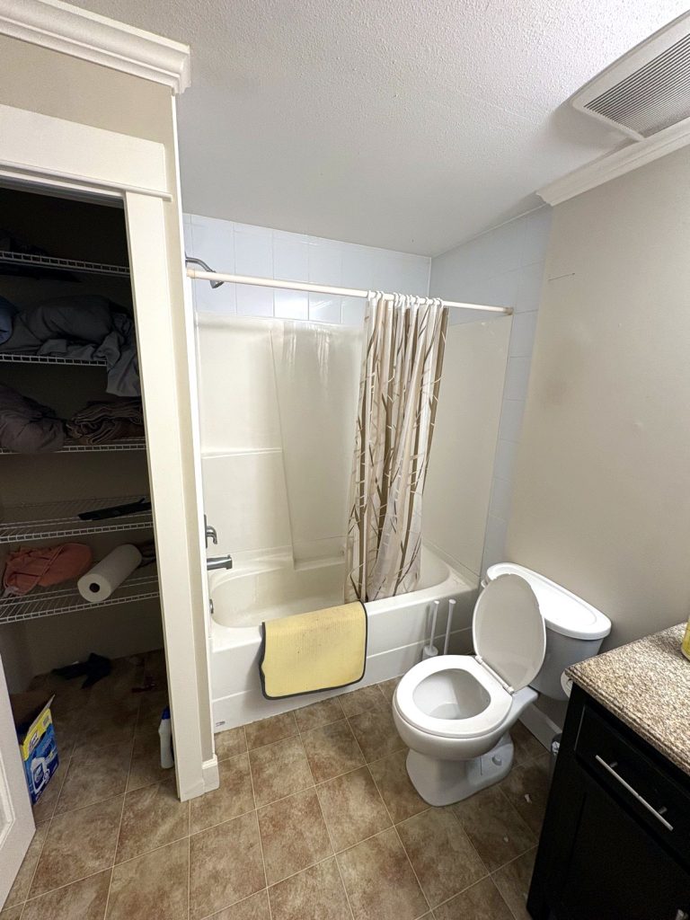 Old tub shower combo in Langley bathroom before renovation