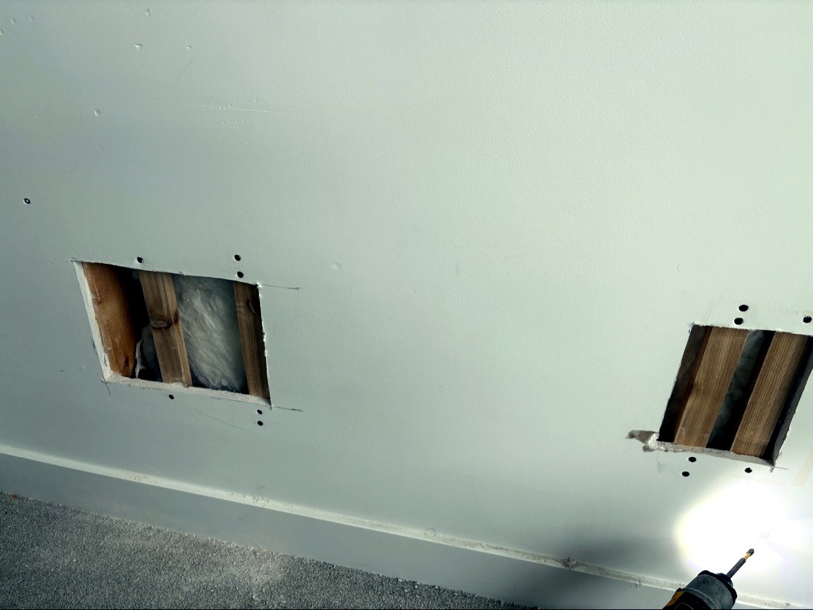 Fitting new drywall patch into wall opening Vancouver