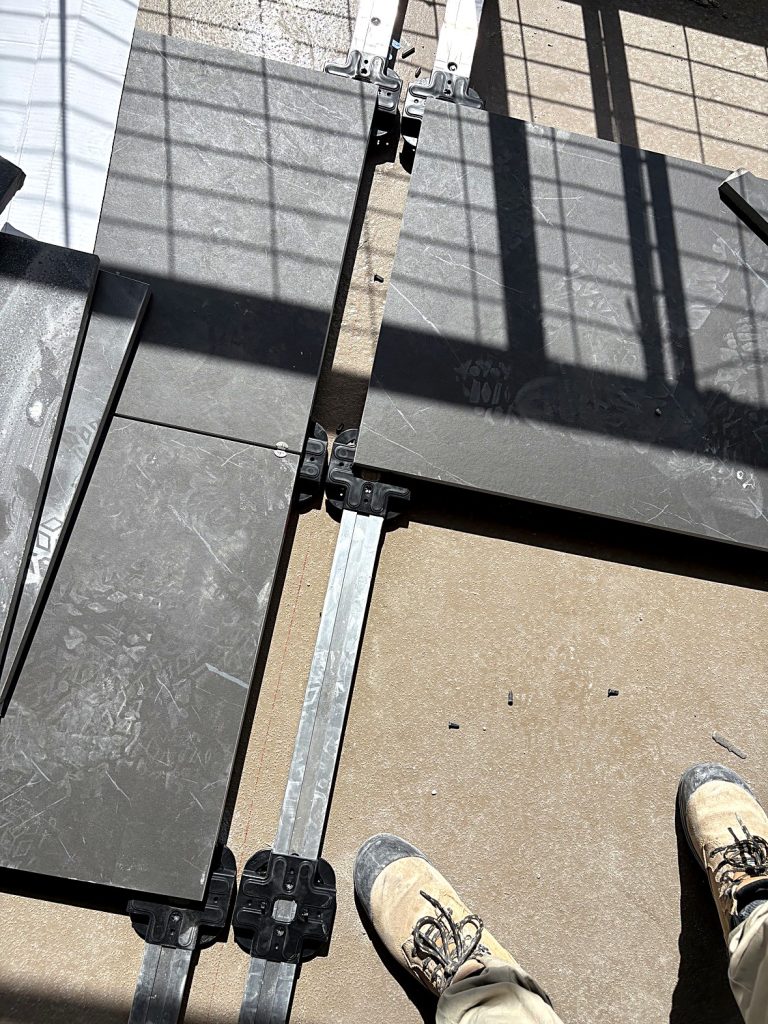Porcelain pavers on aluminum tracks and pedestals Burnaby balcony