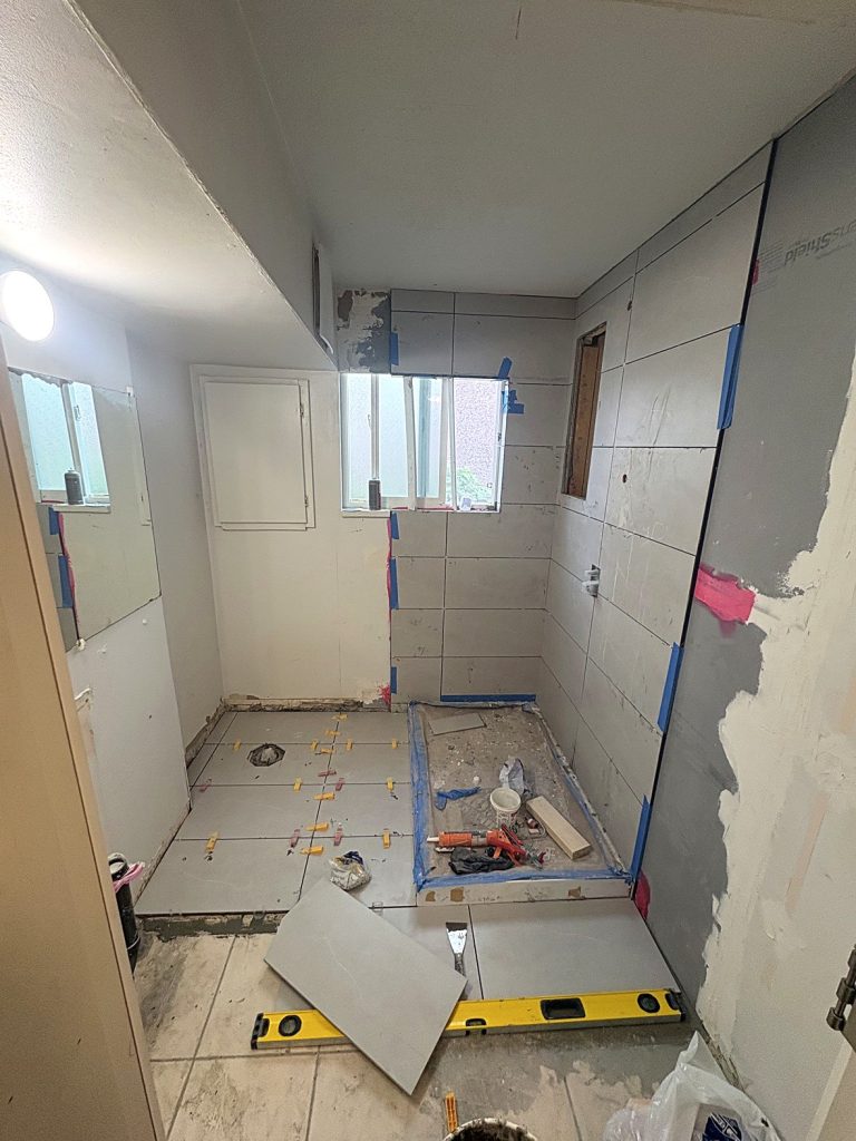 Bathroom tile installation with leveling system Vancouver BC