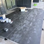 Large format balcony tiling in progress Burnaby BC