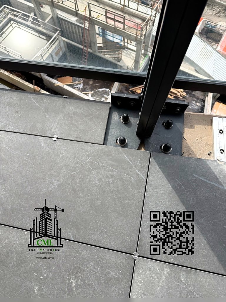 Finished porcelain paver balcony by Craft Master Luxe Construction Burnaby