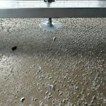 Sealed anchor bolt in waterproofed balcony slab Burnaby BC