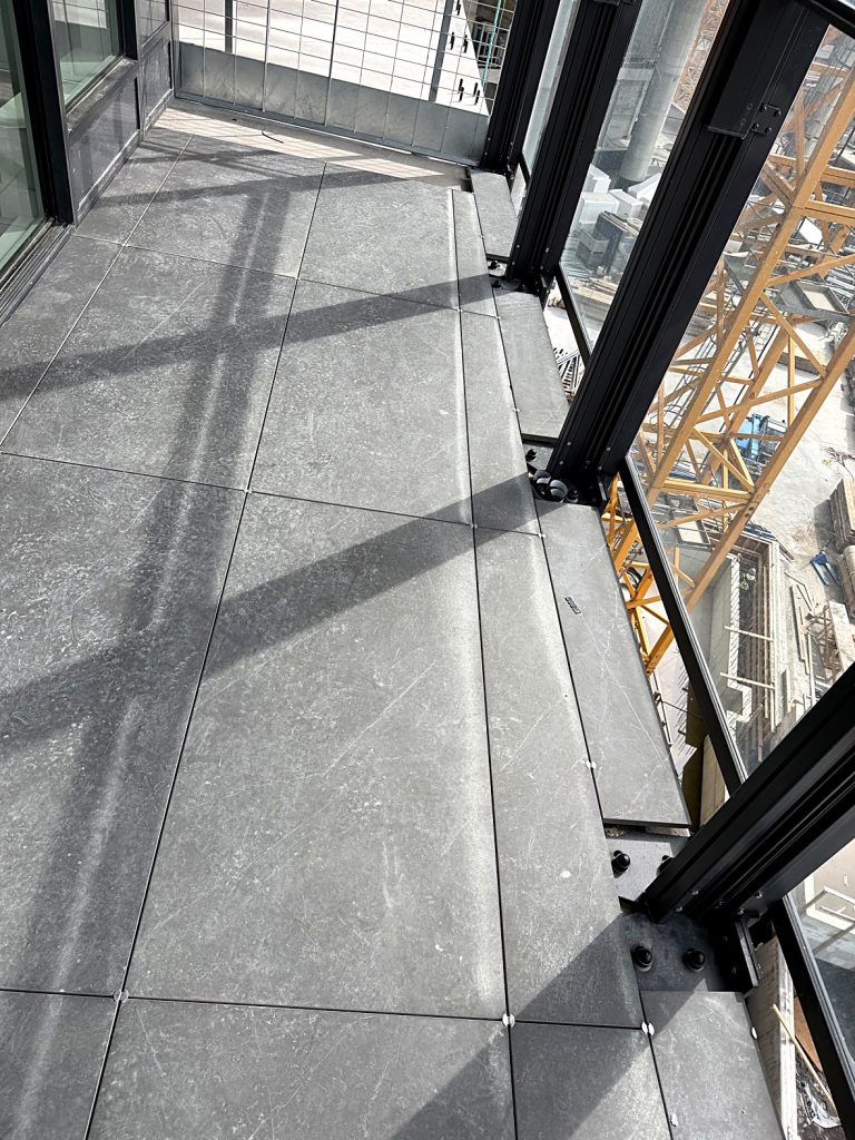 Finished porcelain pavers at balcony sliding door Burnaby BC