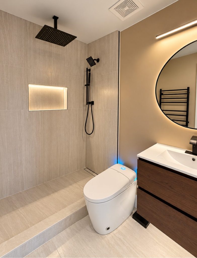 Finished bathroom, second angle, with smart toilet lid closed and vanity, Burnaby BC