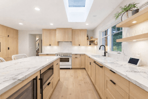 Modern kitchen renovation in Vancouver with custom cabinets and quartz countertops
